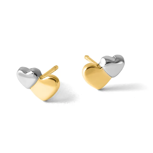 A pair of two-tone gold and silver heart-shaped earrings with matching heart studs, displayed from two angles.