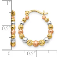 A pair of tri-color gold hoop earrings with alternating textured and smooth beads in yellow, white, and rose gold, shown with measurement scale indicating approximately one inch in length.