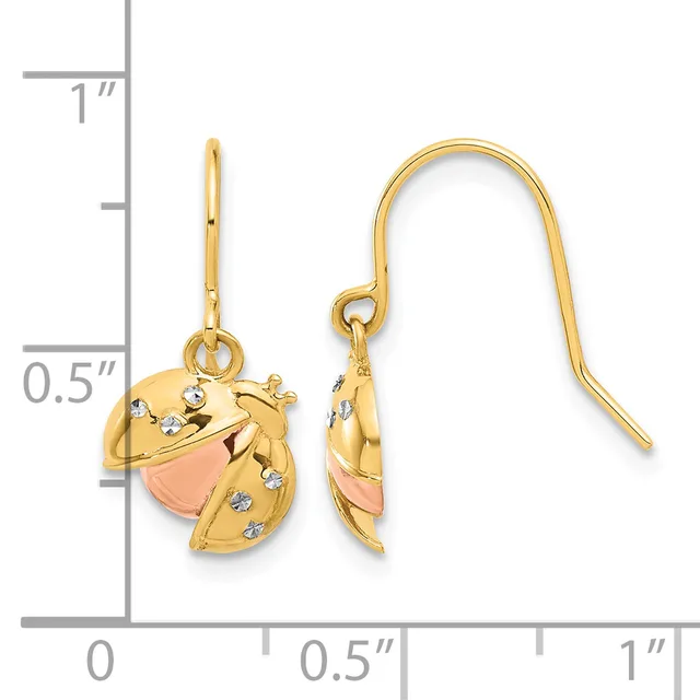 Gold-tone drop earrings with rose-colored accents and small crystal embellishments, shown next to a measurement scale.