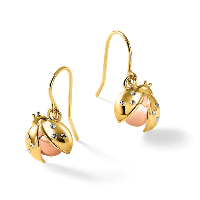 A pair of gold ladybug-shaped drop earrings with rose gold bodies and small diamond accents, displayed on a white background.