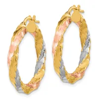A pair of tricolor hoop earrings in yellow, rose, and white gold with a textured finish and matching posts with small disc tops.