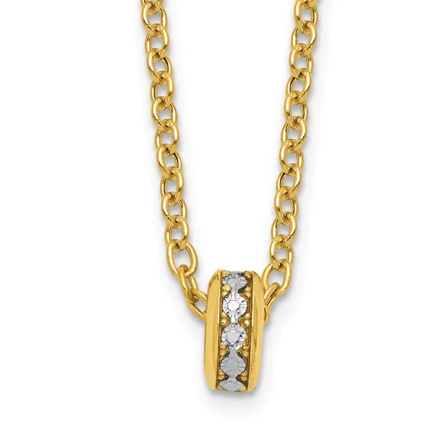 A gold chain necklace with a small cylindrical pendant set with round diamonds in the center, shown against a white background.
