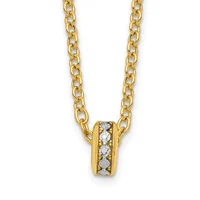A gold chain necklace with a small cylindrical pendant set with round diamonds in the center, shown against a white background.