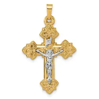 Two-tone gold crucifix pendant with ornate floral design at each of the four ends and a silver-colored corpus of Christ in the center.
