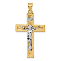 A two-tone gold crucifix pendant with a polished yellow gold cross and a white gold corpus figure, featuring textured detailing on the cross arms and a small hallmark.