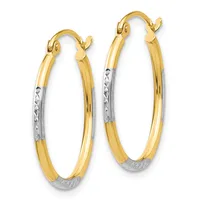 Pair of two-tone gold hoop earrings with textured white gold sections at the bottom and polished yellow gold upper portions, featuring hinged closures.