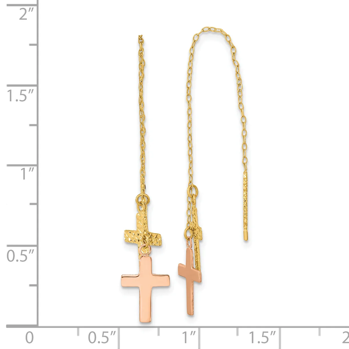 Two gold-toned threader earrings with rose-gold cross pendants suspended from delicate chain links, displayed against a measurement scale.