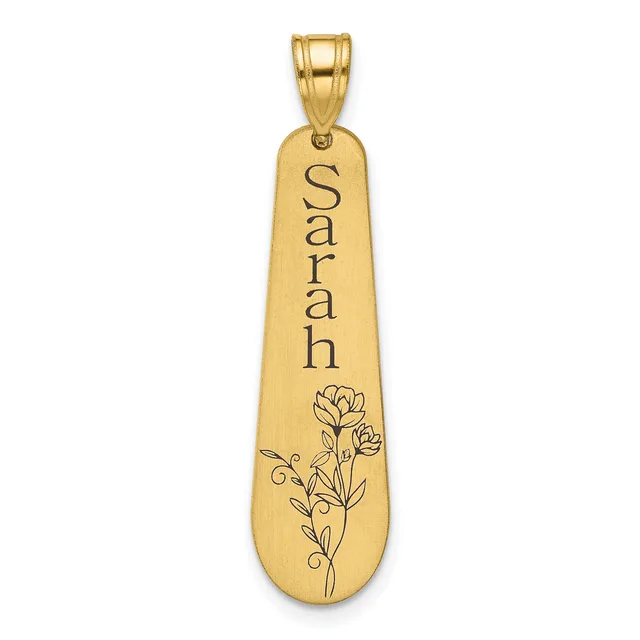 Gold-toned elongated pendant with the name "Sarah" engraved vertically and a floral design featuring a carnation flower with leaves etched below.