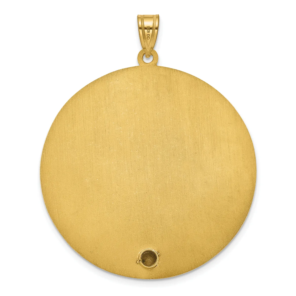 A large circular gold pendant with a brushed finish and a small dark stone or setting near the bottom, suspended from a gold bail.
