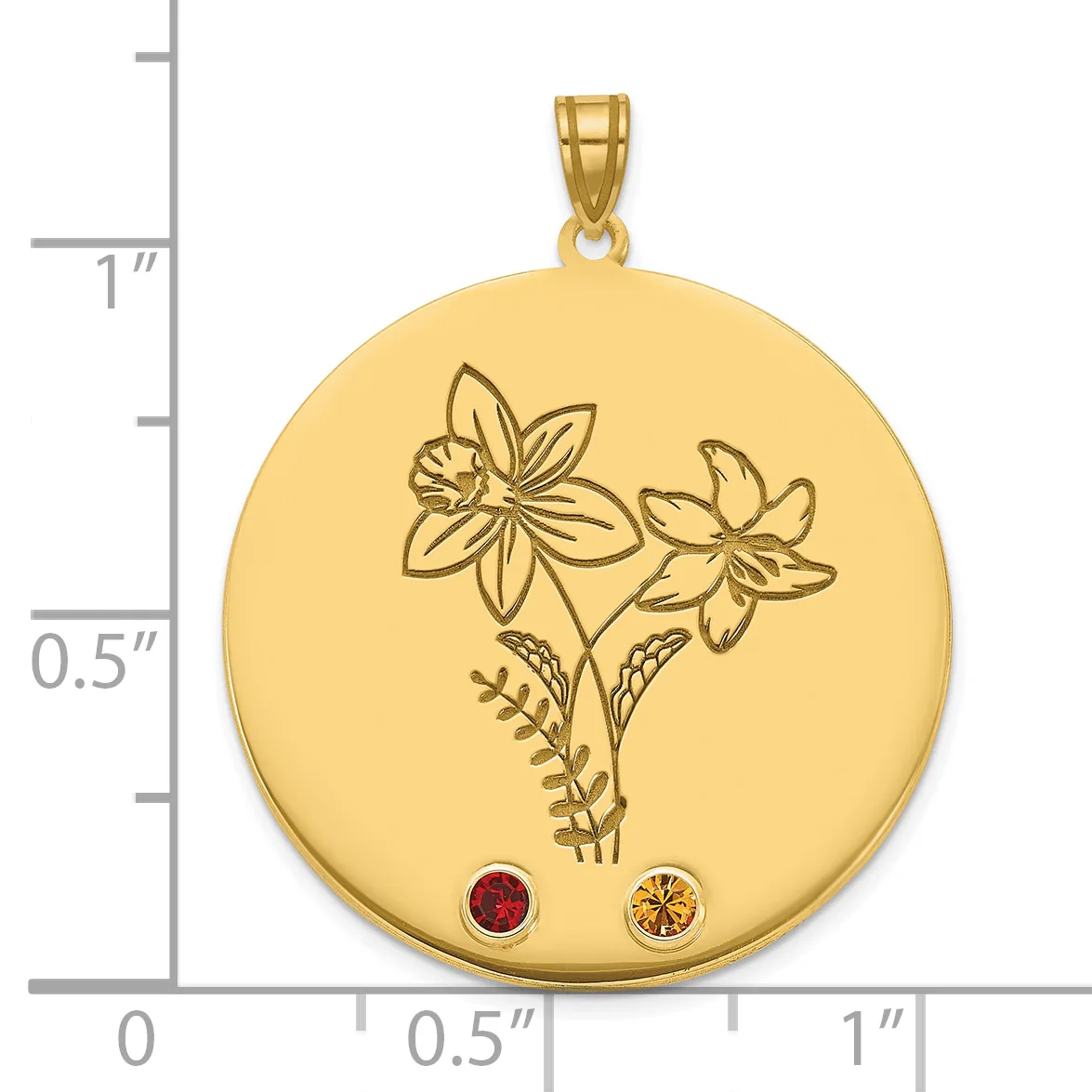 Gold circular pendant with engraved flowers and leaves, decorated with a red gemstone and a yellow gemstone at the bottom, shown next to a ruler for scale.