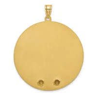 A large circular gold pendant with a brushed matte finish and two small round bezels near the bottom, suspended from a gold bail.