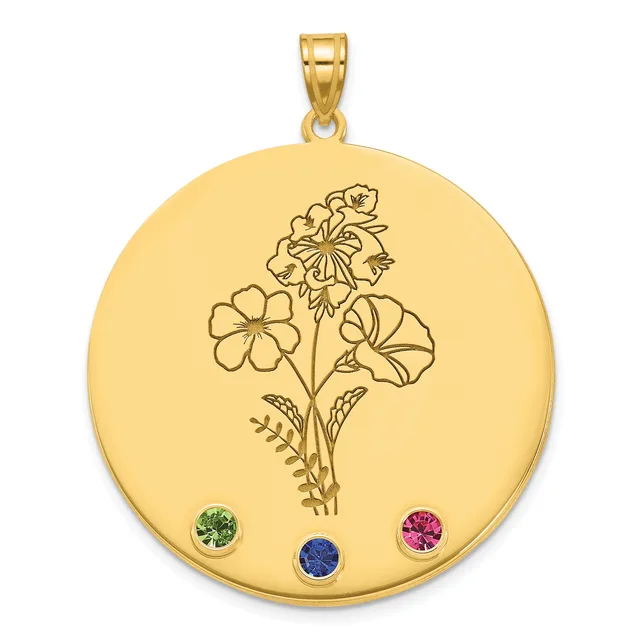 Gold circular pendant with an engraved floral design and three round gemstones in green, blue, and pink set near the bottom.