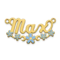Gold-toned metal charm with the word "mom" in script lettering, decorated with blue enamel flowers along the bottom and small loops at each end for attachment.