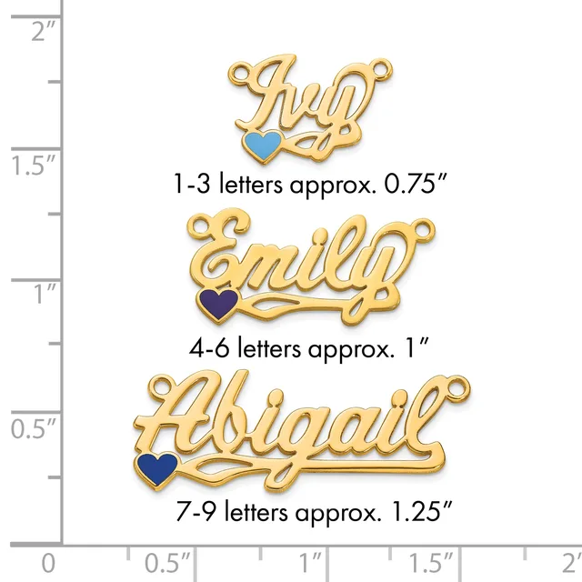 Three gold-colored name pendants with colored heart charms shown at actual size next to a ruler, ranging from approximately 0.75 to 1.25 inches in width.