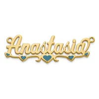 Gold-colored nameplate pendant with cursive script lettering and blue enamel heart accents along the bottom, featuring small loops at each end.