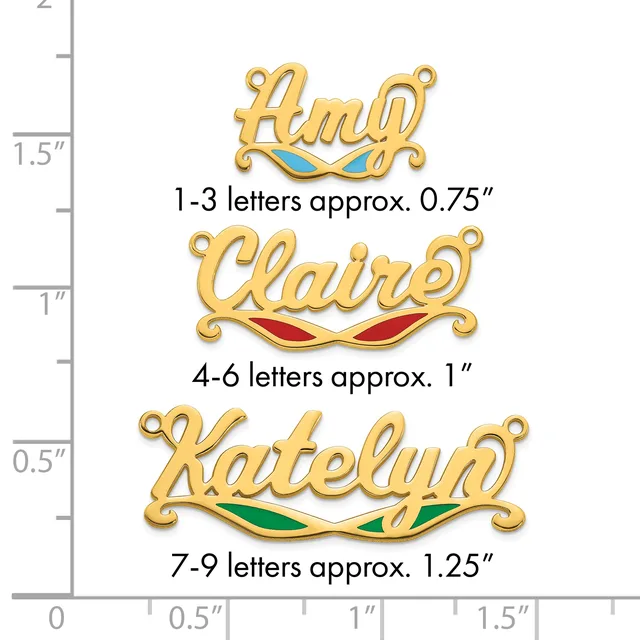 Three gold-toned name pendants with colored enamel accents shown against a measurement ruler, ranging from approximately 0.75 to 1.25 inches in height.