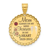 Gold-colored round pendant with scalloped edges, engraved text reading "Mom Always On My Mind Forever In My Heart 1929-2022," decorated with a red gemstone, rose flowers, and angel wings.