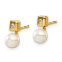 Pair of gold stud earrings with square tops set with small diamonds, each suspending a round white pearl below.