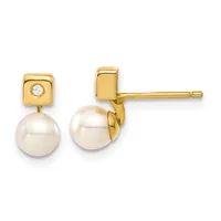 Pair of gold stud earrings featuring square gold tops with small diamonds and suspended round white pearls below.