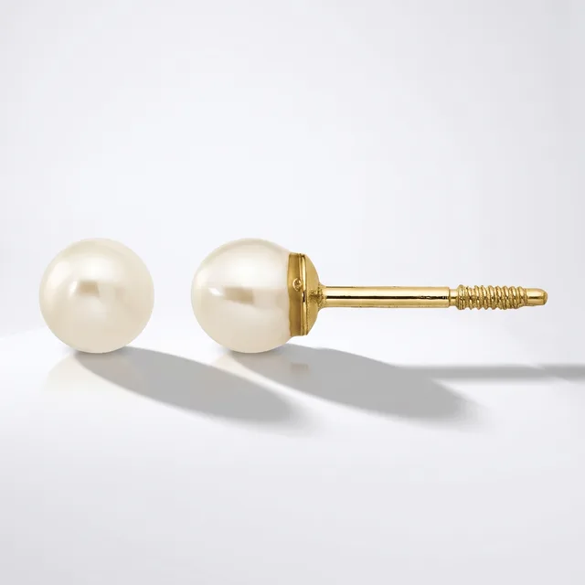 A pair of pearl stud earrings with cream-colored round pearls mounted on gold posts with threaded backs, shown from front and side angles.