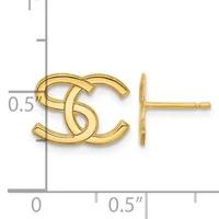 Gold-colored stud earrings shaped like interlocking curved letters, displayed next to a ruler showing approximately 0.5 inches in width.