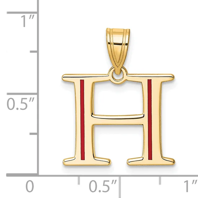 Gold pendant in the shape of the letter H with red enamel vertical stripes, shown next to a ruler indicating approximately one inch in height.
