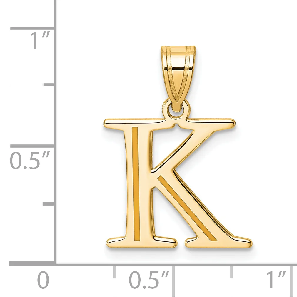 Gold letter K pendant with a polished finish and bail loop, shown next to a ruler indicating approximately one inch in height.