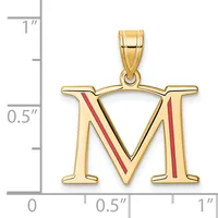 Gold letter M pendant with red enamel diagonal stripes, shown next to a ruler indicating approximately one inch in height.