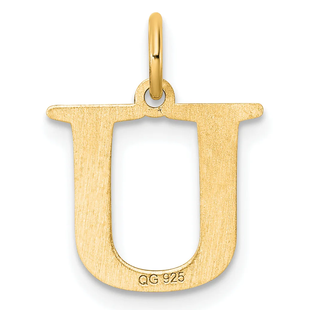 A gold pendant shaped like the letter U with a rounded bottom, featuring a brushed finish and a small stamped hallmark, suspended from a polished gold bail.