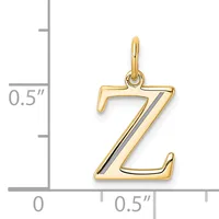 Gold letter Z pendant with black enamel stripe, shown next to a ruler indicating approximately half an inch in height.