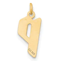 A gold pendant shaped like the number nine with a rectangular cutout, featuring a small stamped hallmark on the lower portion and a looped bail at the top.