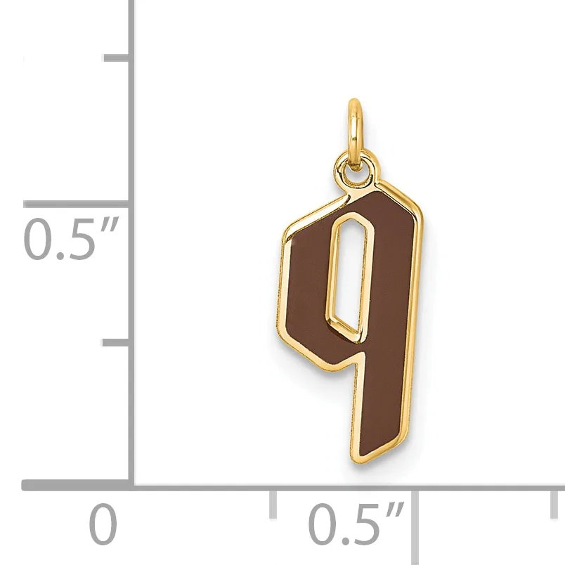 Gold-colored number 9 charm with brown enamel fill and cutout center, shown next to a ruler indicating approximately half-inch height.