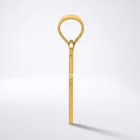 A gold-toned metal teaspoon with a long handle and a loop-shaped bowl end, displayed vertically against a white background.