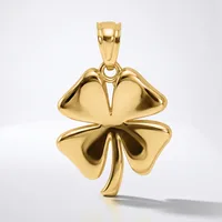A polished gold four-leaf clover pendant with a curved stem, shown suspended against a white background.
