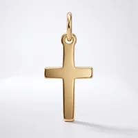 A polished gold cross pendant with a rounded loop at the top, displayed against a white background.