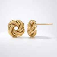 Pair of gold twisted knot stud earrings with textured surfaces, displayed against a white background.