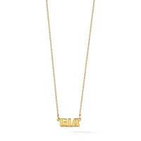 Gold necklace with a delicate chain holding a rectangular pendant with raised block letters spelling a three-letter name.