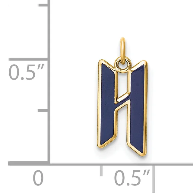 Gold-toned pendant with dark blue enamel panels and an open geometric cutout design, shown against a measurement scale indicating approximately 0.5 inches in height.