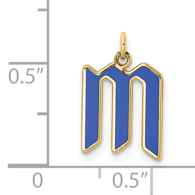 Gold-framed pendant with blue enamel in the shape of the letter M, shown next to a measurement scale indicating approximately half an inch in width and height.