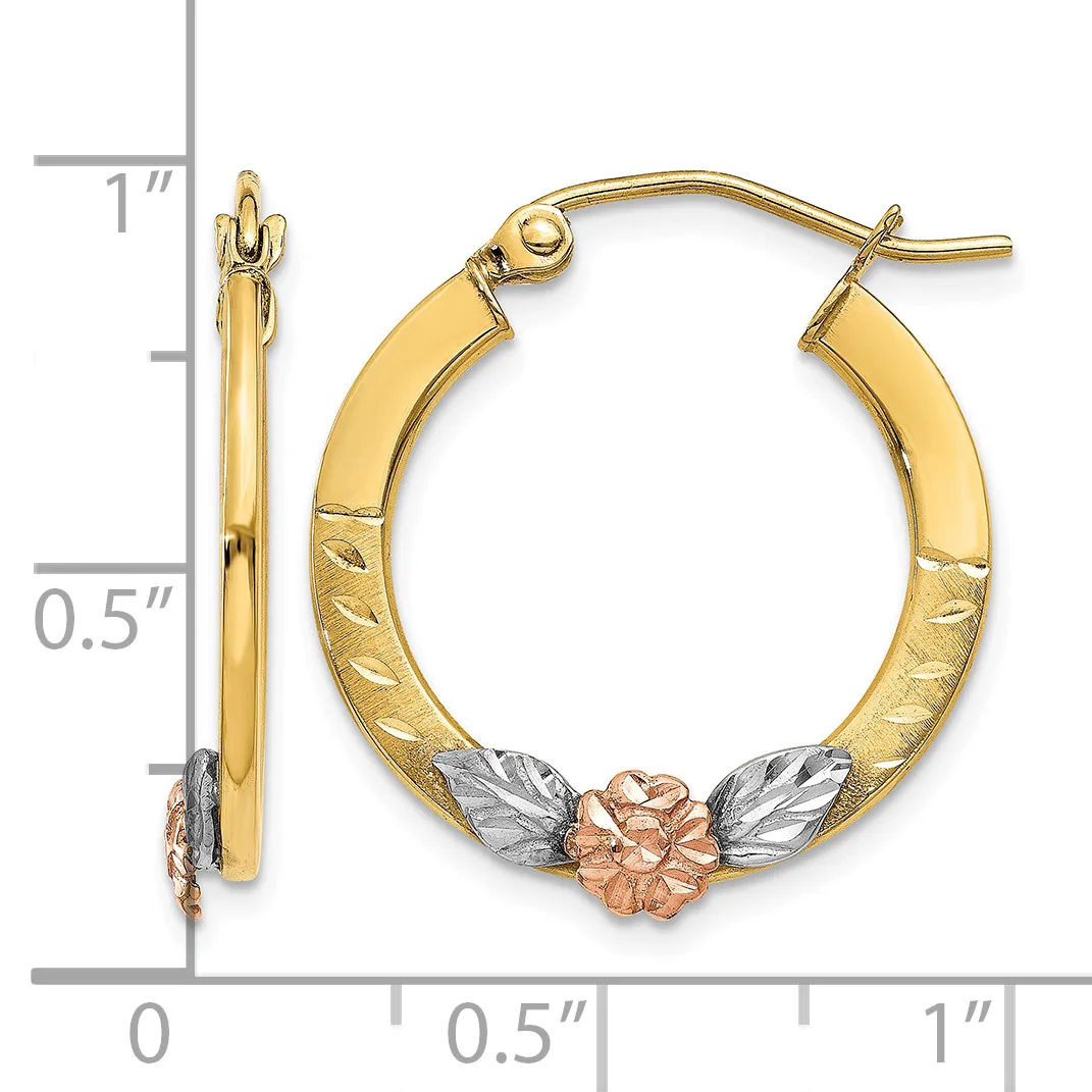 Gold hoop earrings with textured surfaces and a small rose gold flower with white gold leaves accent at the bottom, shown next to a ruler for scale.