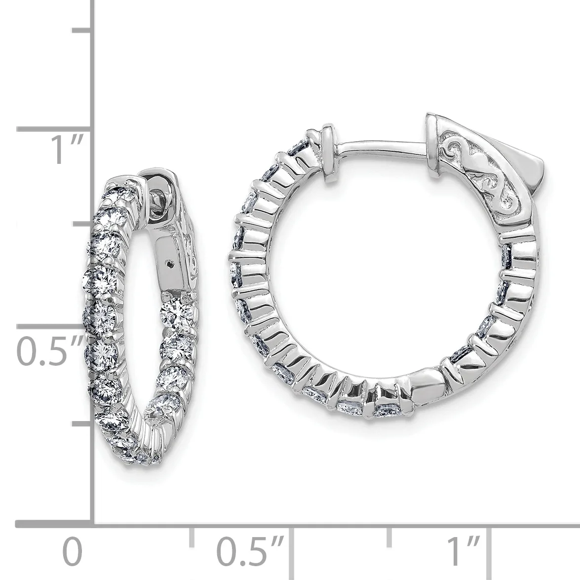 A pair of silver hoop earrings with diamond accents shown next to a ruler measuring approximately one inch in length.