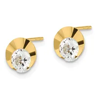 Pair of gold stud earrings with polished gold circular backs and clear round gemstones set in the center, shown against a white background.