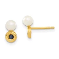 Pair of gold stud earrings featuring white pearls on top and small dark blue sapphires below, shown from front and side views.
