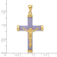 A lavender jade cross pendant with gold-tone metal corners and a gold-tone crucifix figure in the center, displayed against a ruler showing approximately 1.5 inches in height.