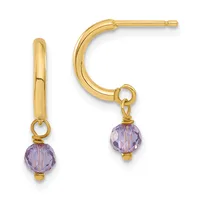 A pair of gold hoop earrings with faceted purple gemstone drops attached by small gold loops.
