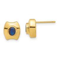 Pair of gold stud earrings with oval blue gemstones set in polished gold bezels, shown from front and side views.