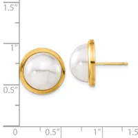 Pair of gold-rimmed pearl stud earrings with white round pearls, shown front and side view next to a measurement scale.