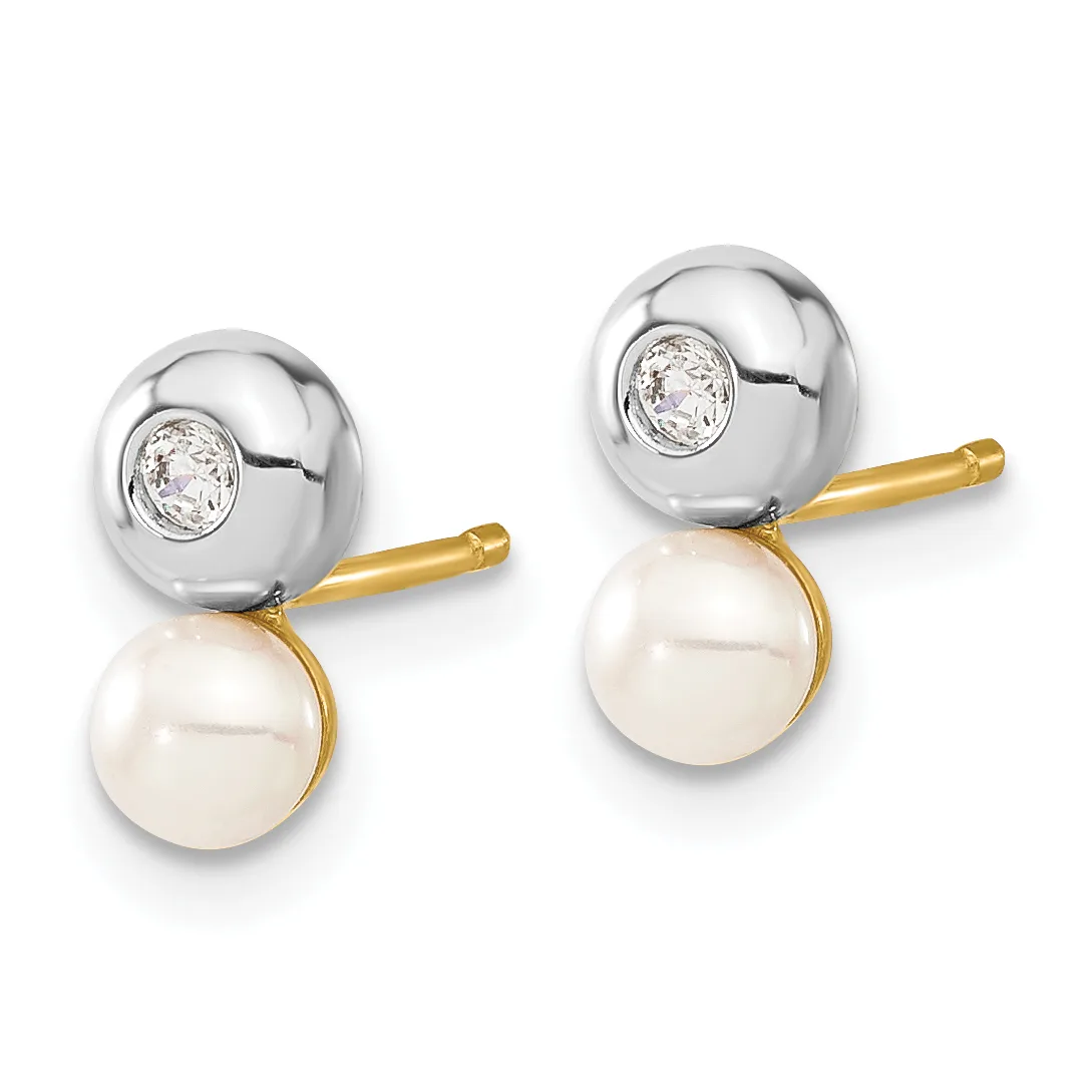 A pair of two-tone earrings featuring silver spheres set with round diamonds above dangling cream-colored pearls, displayed against a white background.