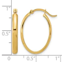 A pair of polished gold oval hoop earrings with hook closures displayed next to a measurement scale showing approximately one inch in height and half inch in width.