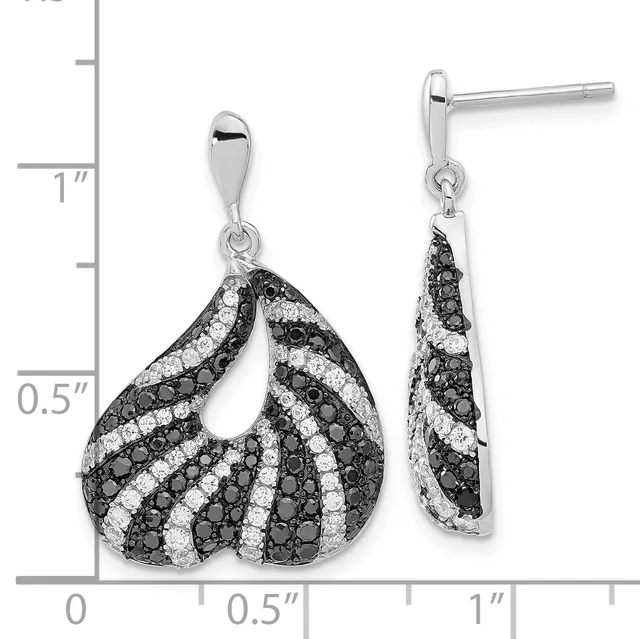 A pair of silver teardrop earrings with alternating black and white diamond pavé stripes, shown with a measurement scale indicating approximately one inch in length.